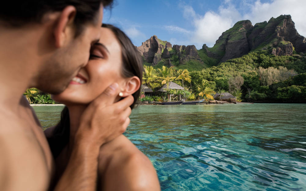 A high-quality photo of a couple enjoying their honeymoon in Bora Bora, French Polynesia. The image is a close-up shot, focusing on the couple's faces as they share a romantic kiss. The background is a tropical paradise with crystal-clear waters and lush, green vegetation.